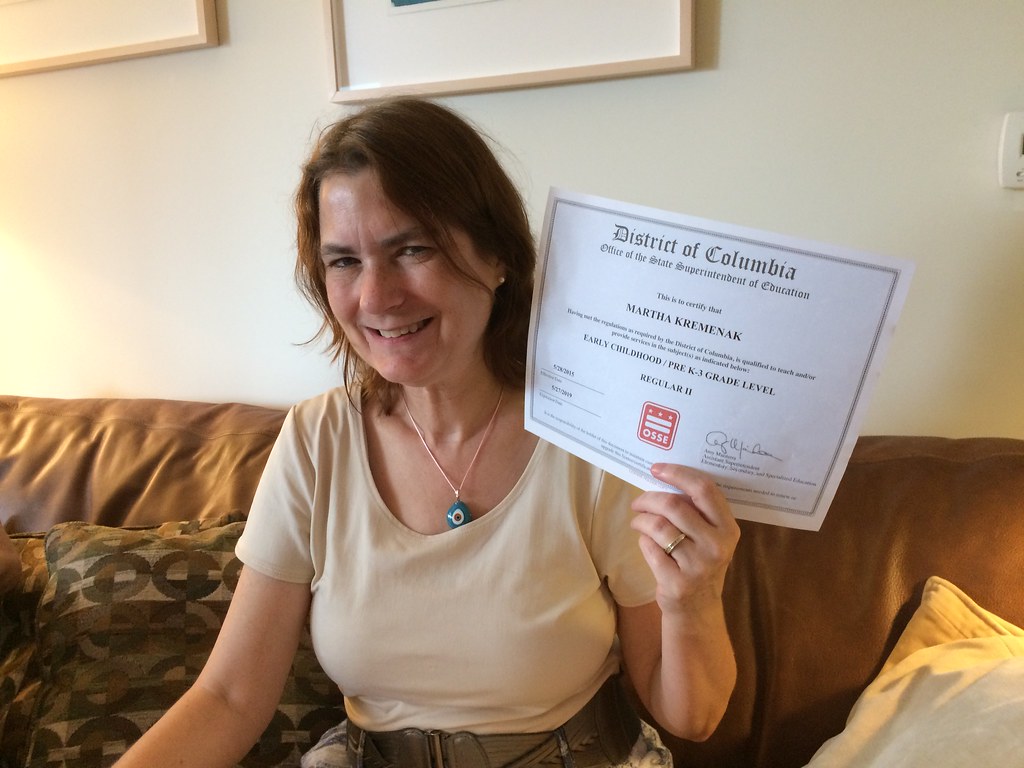 teaching certificate held by woman