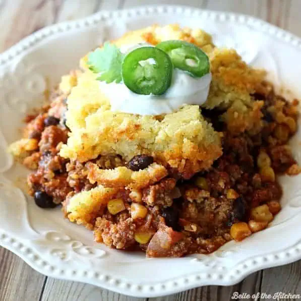 a serving of cheap and easy chili cornbread casserole in a white bowl