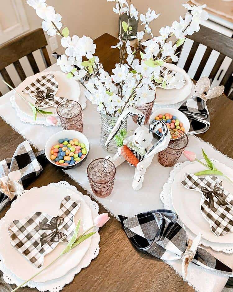 Easter Tablescape ideas, buffalo plaid bunny plates on white dishes with black and white buffalo print napkins.