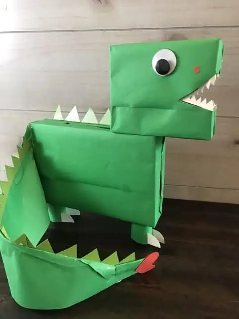 green dinosaur valentine box DIY with long tail and heart at the end