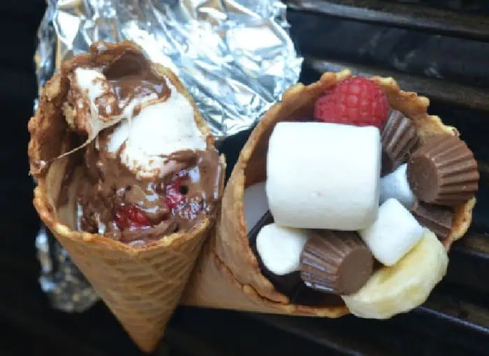 A campire dessert maqde with chocolate, marshmallow and fruit then wrapped in tin foil and baked in a campfire.