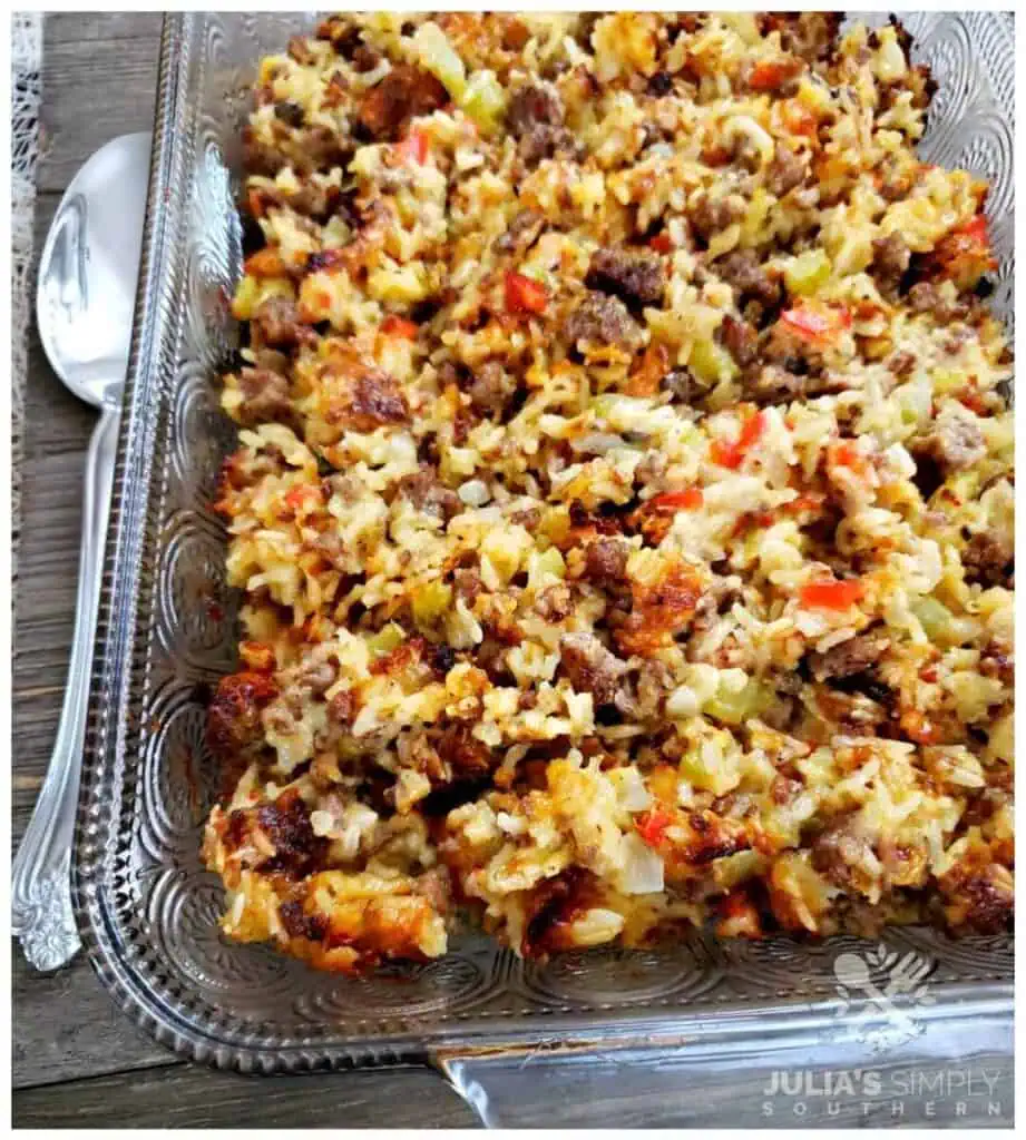 Easy Sausage and Rice Casserole in a glass casserole dish with a spoon beside it