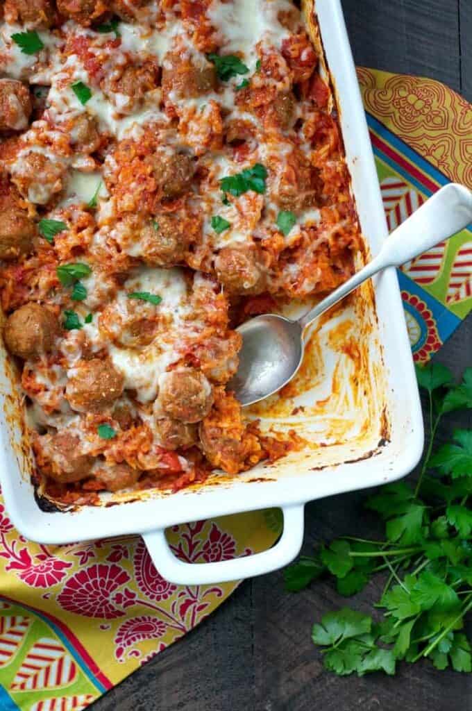 quick and easy Italian meatball and rice casserole in a 9x13 white pan 