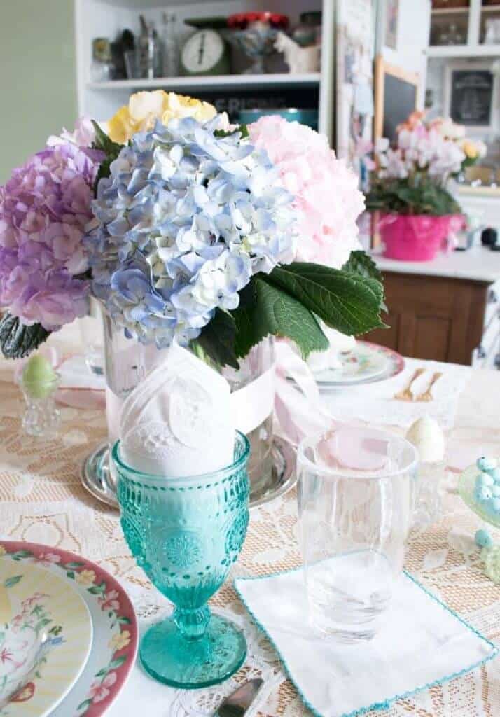 Easter Tablescape ideas, blue and pink hydrangea centerpiece, lace tablecloth .
