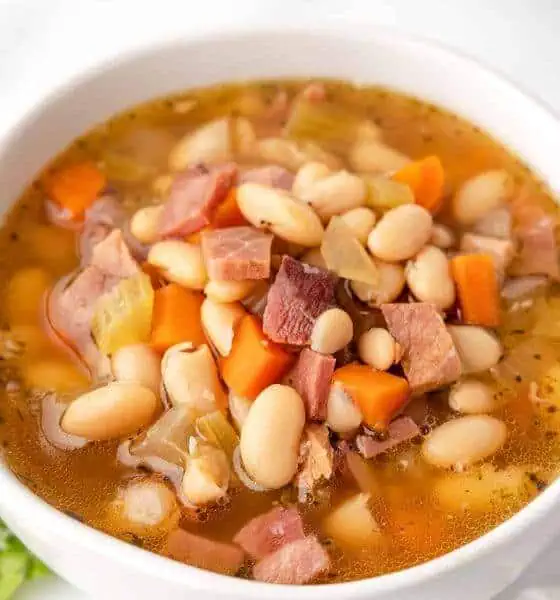 crockpot ham and bean soup in white bowl