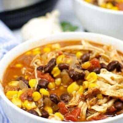 Chicken taco soup being served in bowl.