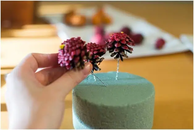 Arrange your pinecones in the floral foam