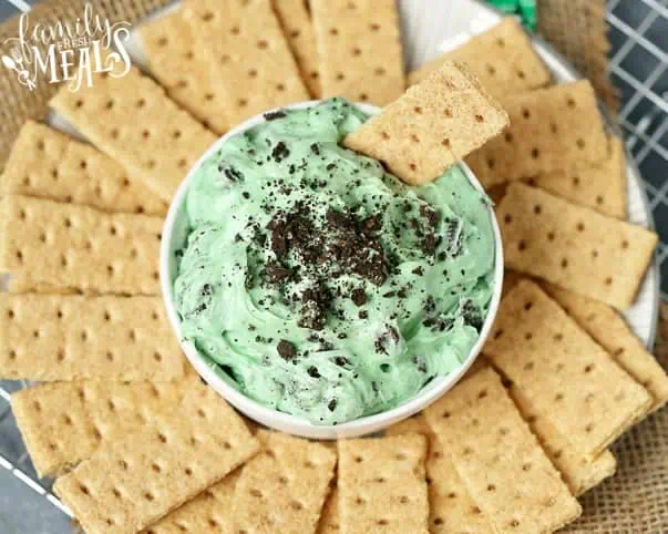 Chocolate Chip Dip green dip served in a white bowl with graham crackers