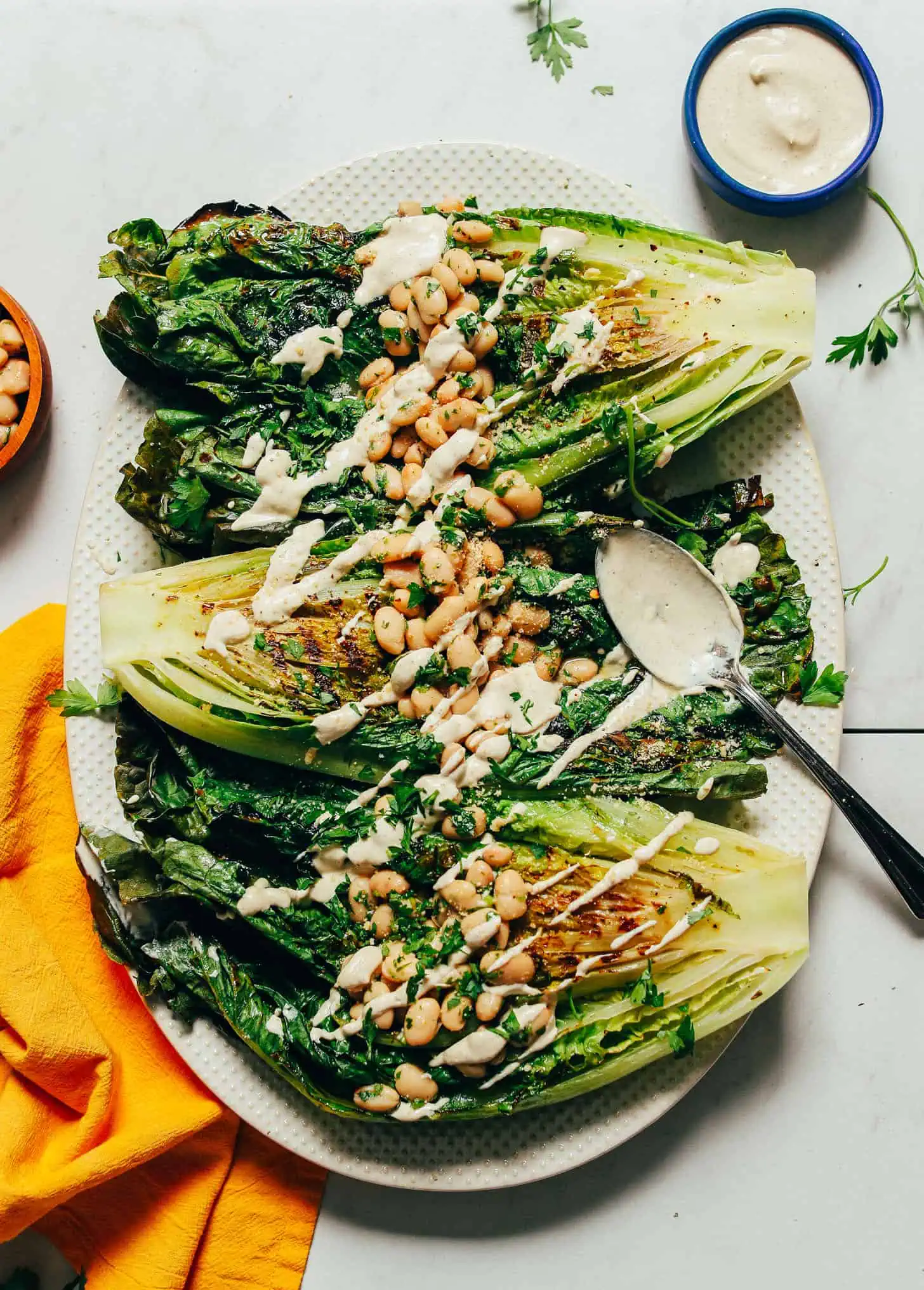 DELICIOUS Grilled Romaine Salad with Lemon Herbed Beans and Quick Caesar Dressing. 30 minutes BIG flavor so wholesome glutenfree plantbased romaine salad minimalistbaker 11