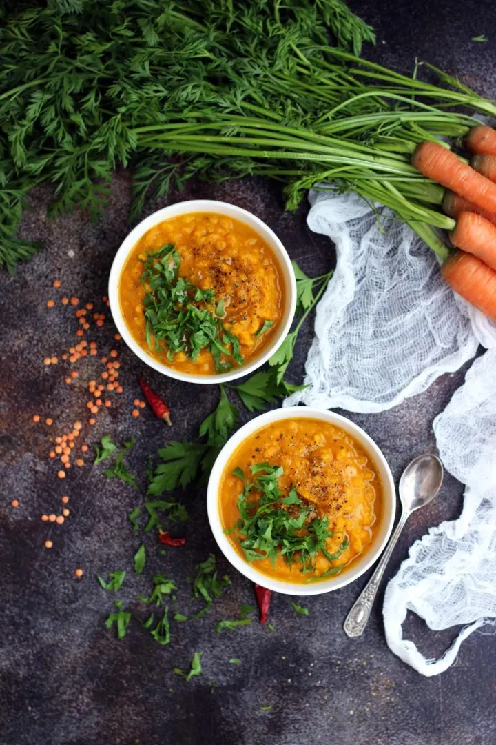 Vegan Roasted Carrot Soup with Lentils in Bowls Garnished with Parsley