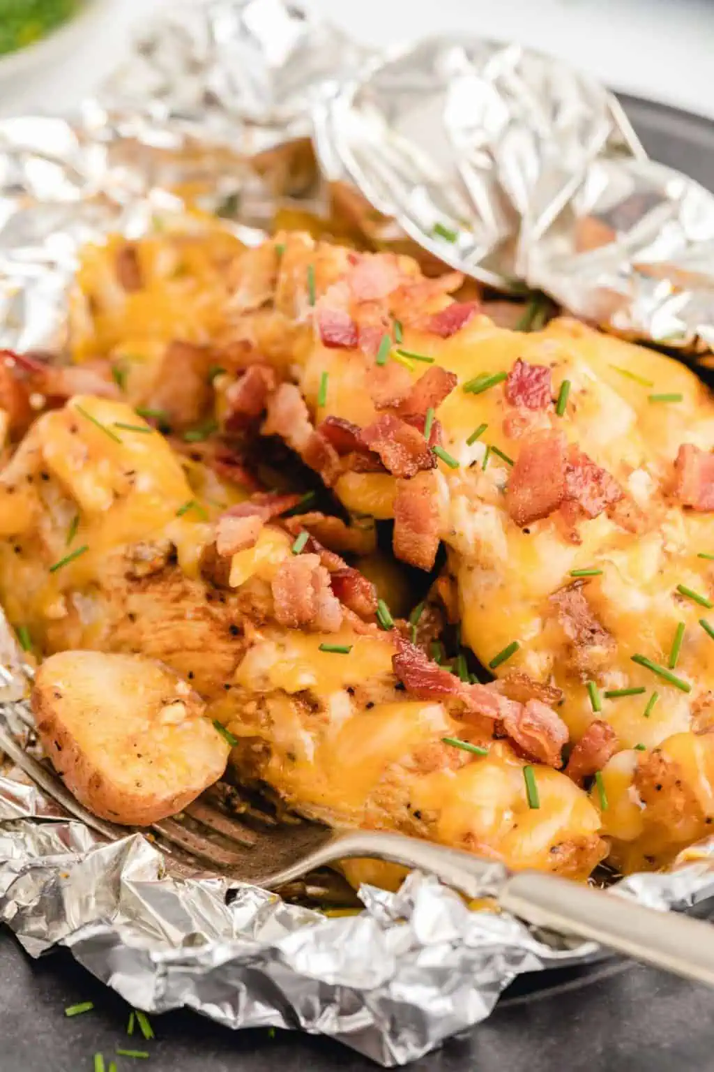 A variety of colorful and delicious foil packets for the oven featuring chicken foil packets, vegetable foil packets, and seafood foil packets in aluminum foil.