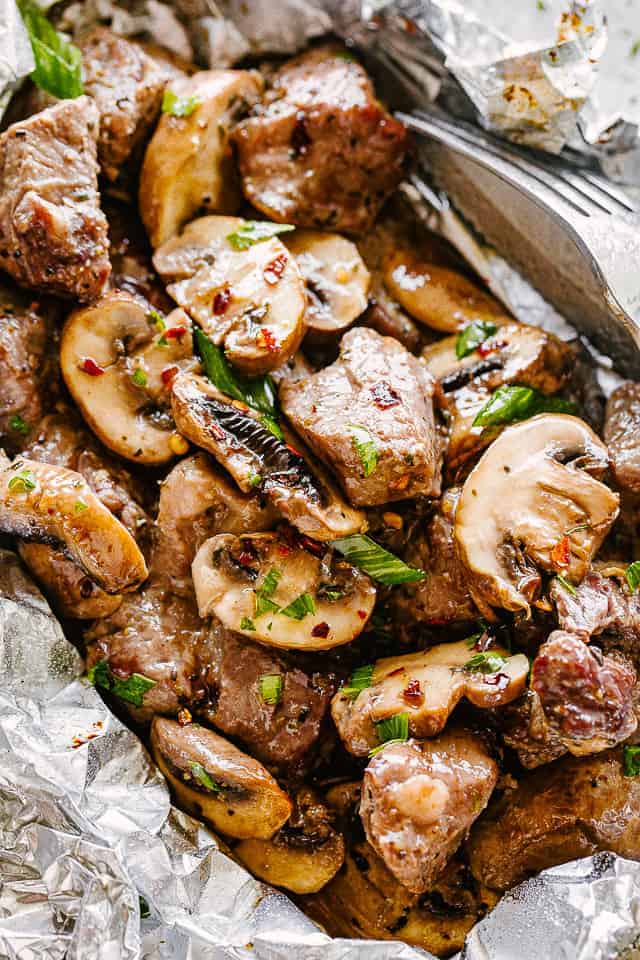 A variety of colorful and delicious foil packets for the oven featuring chicken foil packets, vegetable foil packets, and seafood foil packets in aluminum foil.