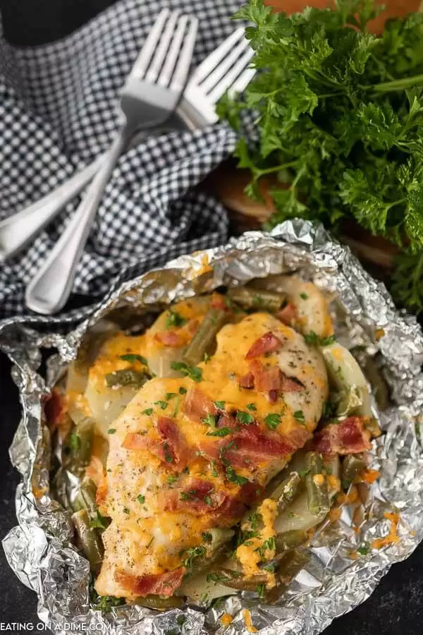 A variety of colorful and delicious foil packets for the oven featuring chicken foil packets, vegetable foil packets, and seafood foil packets in aluminum foil.