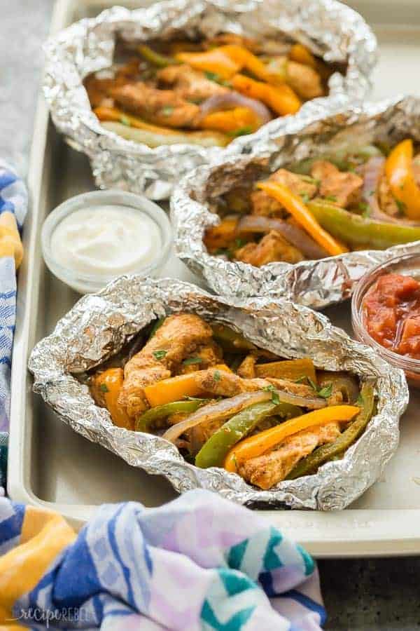 A variety of colorful and delicious foil packets for the oven featuring chicken foil packets, vegetable foil packets, and seafood foil packets in aluminum foil.