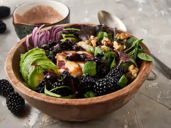 image 10440 - This salad is a delicious, juicy secret... one we're excited to share with you! Roasted Blackberry Chicken Salad is the most beautiful, flavorful choice you can make for yourself. A delicious blackberry-balsamic dressing coats a fresh medley of spring greens and savory golden chicken slices. So vibrant! So nourishing! Roasted Blackberry Chicken Salad is an uplifting new salad option! The secret is out... and it's so delicious!