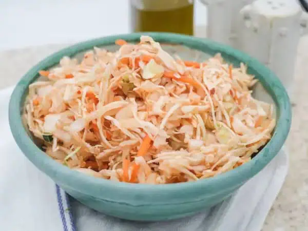 image 14618 - This Carolina Red Slaw isn't just named this because it's reaching for the down South feeling with its barbeque and ketchup-infused dressing! It's also because this slaw has got a bit of that classic Carolina kick to it; exactly how much is up to your preferences, but you can spice it up so that this once-humble mix of carrots and cabbage really makes a statement! Serve Carolina Red Slaw with your favorite cookout fare and marvel at how much it stands out from the crowd!