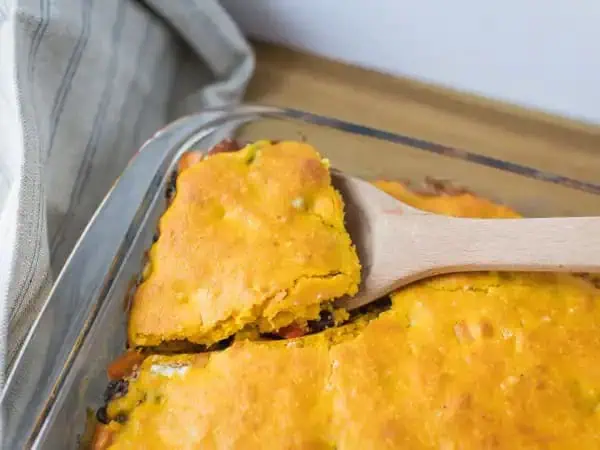 image 16012 - Yee-haw! It's the Texas Bean Bake, y'all! Hearty, creamy beans baked up with caramel-y sweet potatoes, refreshing bell peppers, and spicy chiles, all beneath pumpkin-infused, summer-sweet cornbread. Doesn't get much better than that, we reckon. Saddle up this Texas Bean Bake with freshly grilled steaks and settle into a fine, fine evening!