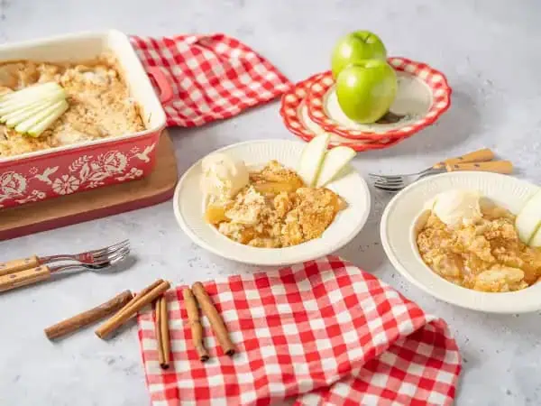 image 16831 - When you unexpectedly find out that your friend is in need, and by "in need" we mean they are needing a sweet fix that only your desserts can provide, add this recipe to your gotta-have-it, quick dessert list. This Apple Dump Cake is the perfect life-saving dessert! The fresh and crisp but tender apples, with a layer of sweetly coddled apple pie filling, are topped with an easy and moist cake that will bring joy to all. Apple Dump Cake is a fast and easy, always-in-the-cabinet kind of answer to all of life's unending "problems", no matter how big or small. Let them dump out all of their worries and their woes because with this therapeutic truffle of happiness, you'll become a real lifesaver and the go-to guru to help all the bad apples, umm we mean, friends in your life.