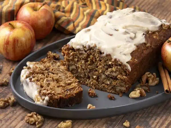 image 17148 - Brunch and fall! What a perfect pair! Whip out your favorite scarf and a delicious spread, then relax and enjoy it with the ones you love most. Might we suggest adding this Amazing Apple Walnut Bread to your marvelous menu? It's moist, crumbly, and brings just enough of those appley and walnut-y flavors to make it feel fall enough. Make sure you don't skip out on the rich and creamy brown butter glaze on top, too. It's so dreamy! Nothing compares to enjoying a delightful mid-morning meal as the leaves flutter to the ground, and this Amazing Apple Walnut Bread can make it even better!