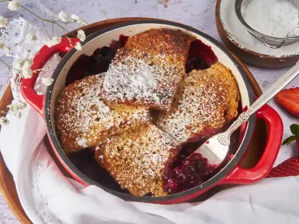 image 17173 - Mornings are easier when you are prepared. One way to do that is by trying this Fuss-Free French Toast Bake. This easy dish can be made the day before to keep your mornings smooth-sailing. The sweet mixed berries are the foundation for the perfectly tender-crisp, cinnamon-y french toast that will make your morning much more serene. Fuss-Free French Toast Bake is the best way to set your day up for success. Start off on the right foot and quit your fussing. You will love it!