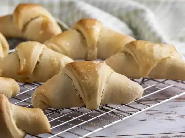 image 17906 - Crescent rolls don't have to just come out of one of those pop cans; you can enjoy their buttery, flaky goodness hot-and-ready straight from your own kitchen! These Homemade Crescent Rolls are a simple yet tasty side that pairs well with just about everything, including (and maybe especially) breakfast! Grab some butter, or honey, or your favorite sauce, because these Homemade Crescent Rolls are perfect for scooping and snacking!