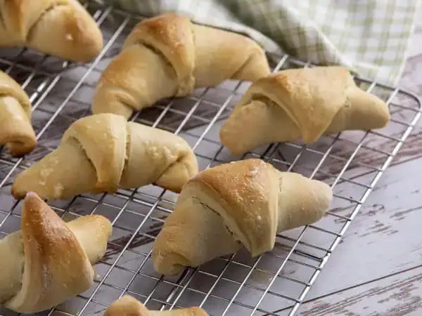 image 17907 - Crescent rolls don't have to just come out of one of those pop cans; you can enjoy their buttery, flaky goodness hot-and-ready straight from your own kitchen! These Homemade Crescent Rolls are a simple yet tasty side that pairs well with just about everything, including (and maybe especially) breakfast! Grab some butter, or honey, or your favorite sauce, because these Homemade Crescent Rolls are perfect for scooping and snacking!