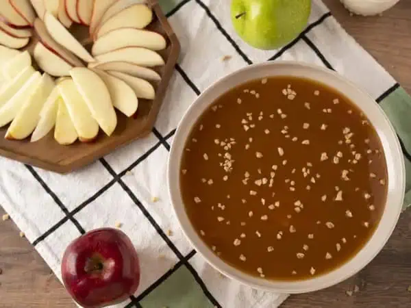 image 21134 - Bobbing for apples is a rich autumn tradition, as are giant caramel apples. Caramel Apple Dip is the best of both traditions and, trust us, it's a delicious combination! Get ready to dunk your apples in a creamy, buttery, sugary caramel sauce, with bits of crunchy toffee, as you enjoy the perfect combination of crisp, fresh fruit with candy-indulgence draped all over it. Caramel Apple Dip is a fall carnival of delights that's ready in a flash!