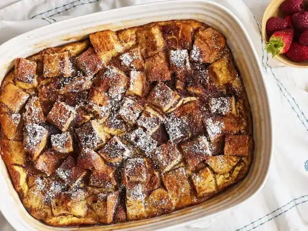 image 3221 - If you love French toast, then we think it's mandatory for you to try this Brown Sugar French Toast Casserole! You will be absolutely obsessed with the way the French bread cubes soak up all the buttery, brown sugary goodness. It's a breeze to make and a delight to serve. Sprinkled with a bit of powdered sugar, fill up to your heart's content with Brown Sugar French Toast Casserole!