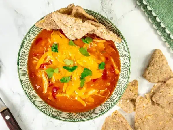 image 3734 - Giddy on up for some of the best homemade grub you ever did taste! King Ranch Soup will have you riding high in the flavor saddle! A delicious, tomato-jalapeño-filled broth with chicken and peppers makes this ranch-sized bowl of savory deliciousness something to write home on the range about (ha, ha). With some tortilla chips riding alongside, let this zesty, buckin' bronco, King Ranch Soup, be the kick your campfire meal needs (not really made on the campfire). Your roaming on the internet for great soup choices is over! Giddy up!