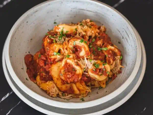 image 4379 - Yummy Baked Tortellini! It tells you all about itself right in the name, and it's just so excited to be on the table. The tortellini are cheesy, tender, and cooked up in an herbaceous tomato sauce, so every bite is rich and inviting! Melty cheese and a crunchy breadcrumb topping adds extra flavor and texture to this already wonderful dish! Yummy Baked Tortellini will make you declare it to be the yummiest dish around!