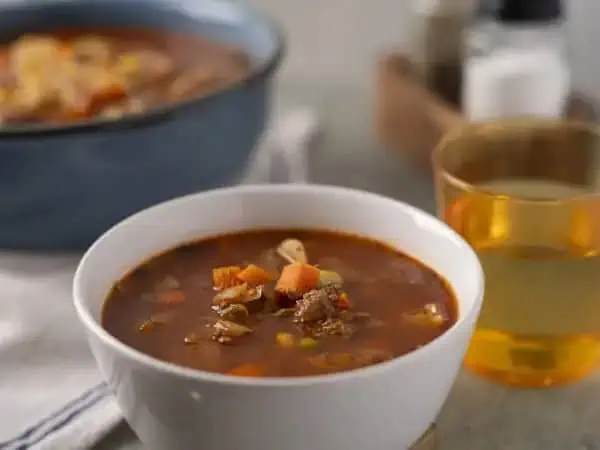 image 4402 - When we're settling in for a warm and cozy night, Grandpa's Beef Soup is our favorite option for dinner. Nothing makes a house feel more like a home than the savory aromas filling the kitchen! A bowlful of this beefy, veggie-filled sipper really just makes you want to curl up and sit by the fire, and that's our exact goal tonight. So, when you're in the mood for that cozy escape, make sure Grandpa's Beef Soup is a part of it.