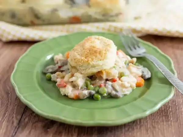 image 7045 - It's a Pot Pie Casserole! It's just as simple and heartwarming as it sounds! A creamy, savory, chicken and vegetable filling with all the richness you're hoping for, with a buttery and flaky biscuit topping! It's the essence of a homemade chicken pot pie in casserole form, making it easier to share! That's how you make wonderful memories: by serving Pot Pie Casserole!