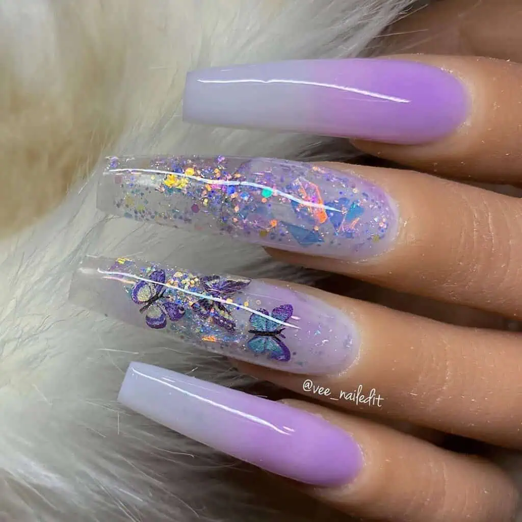 An enchanting showcase of butterfly-themed nails in shades of pink, blue, and purple, elegantly styled on acrylic and coffin shapes.