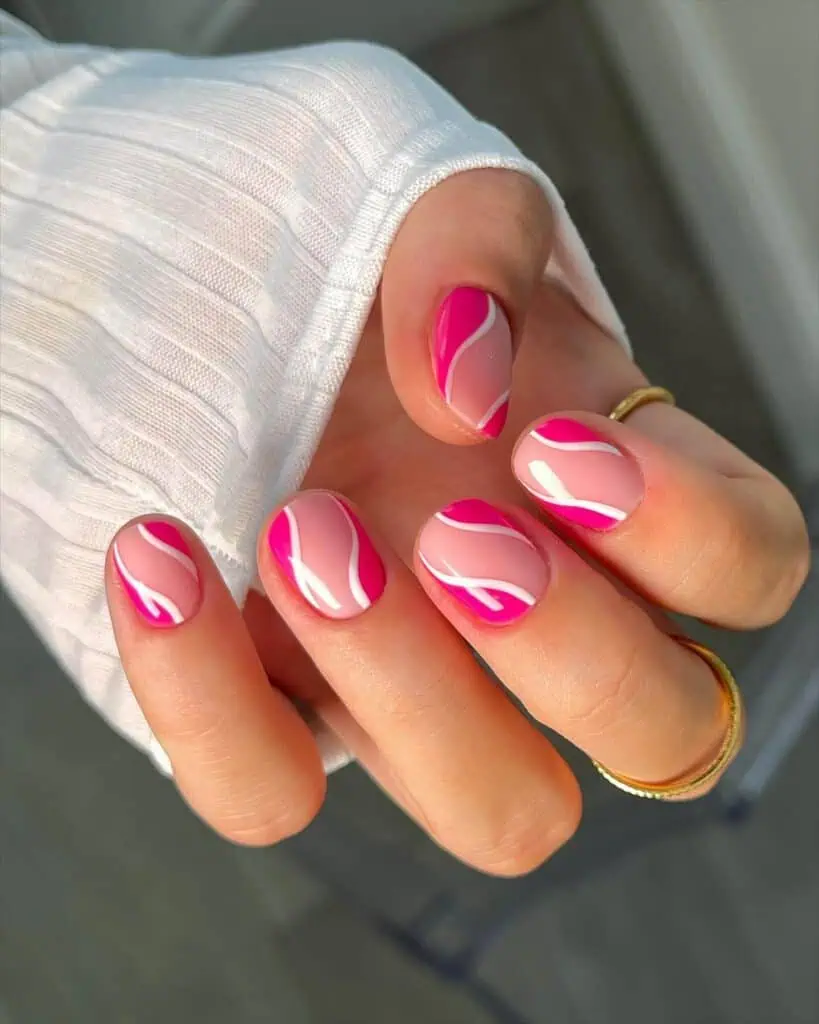 Explore a variety of pink nail designs, from bright and cute styles to festive Christmas nails with intricate patterns and decorations.