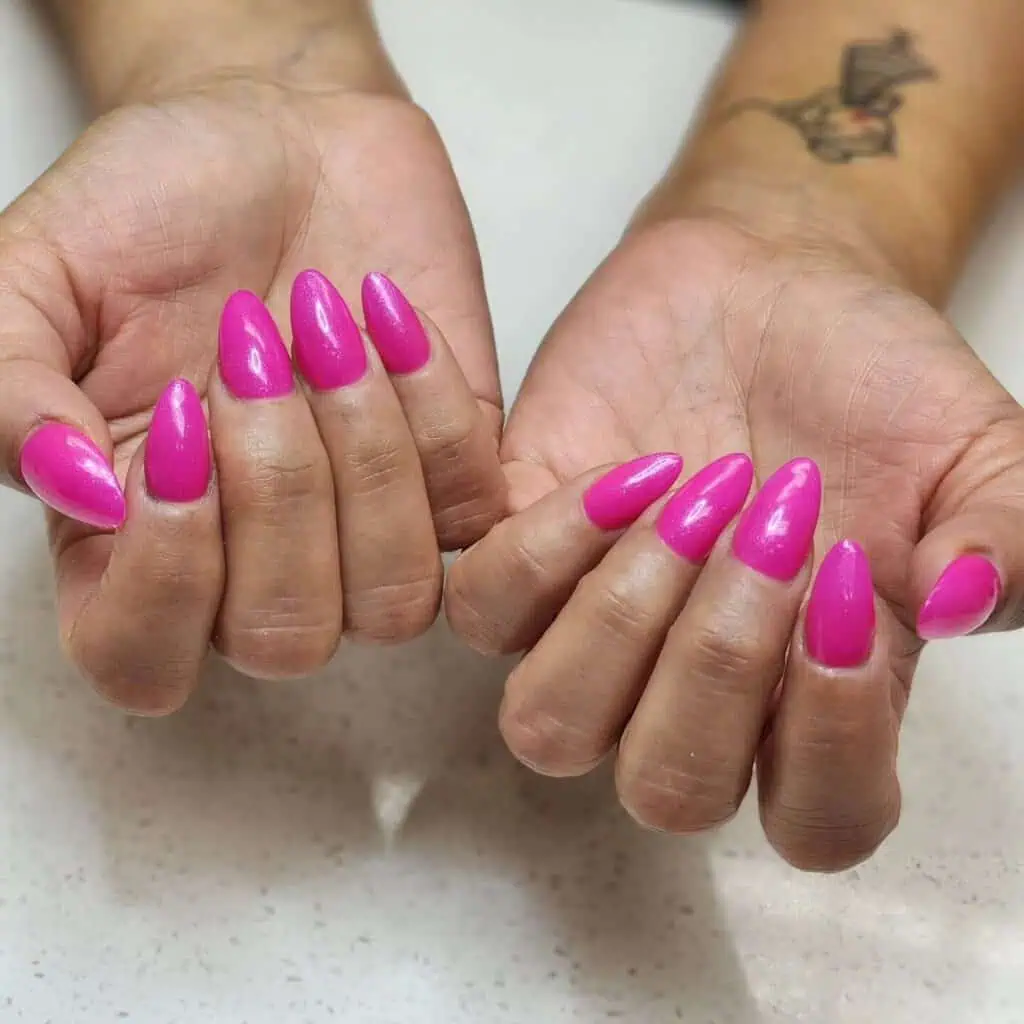 Assortment of summer pink nail colors and styles, featuring vibrant hot pinks, bold neons, and soft pastel pinks, ideal for chic summer nails.