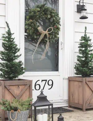 mini Christmas Trees in Wood Planters in front of door