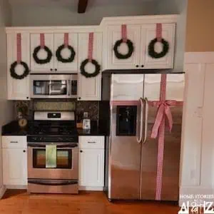 Christmas Wreaths on cabinet and Bow on Refrigerator