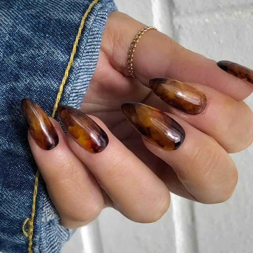 Discover the charm of amber nails with a variety of creative designs, from gel to acrylic styles. Find inspiration for your next manicure.