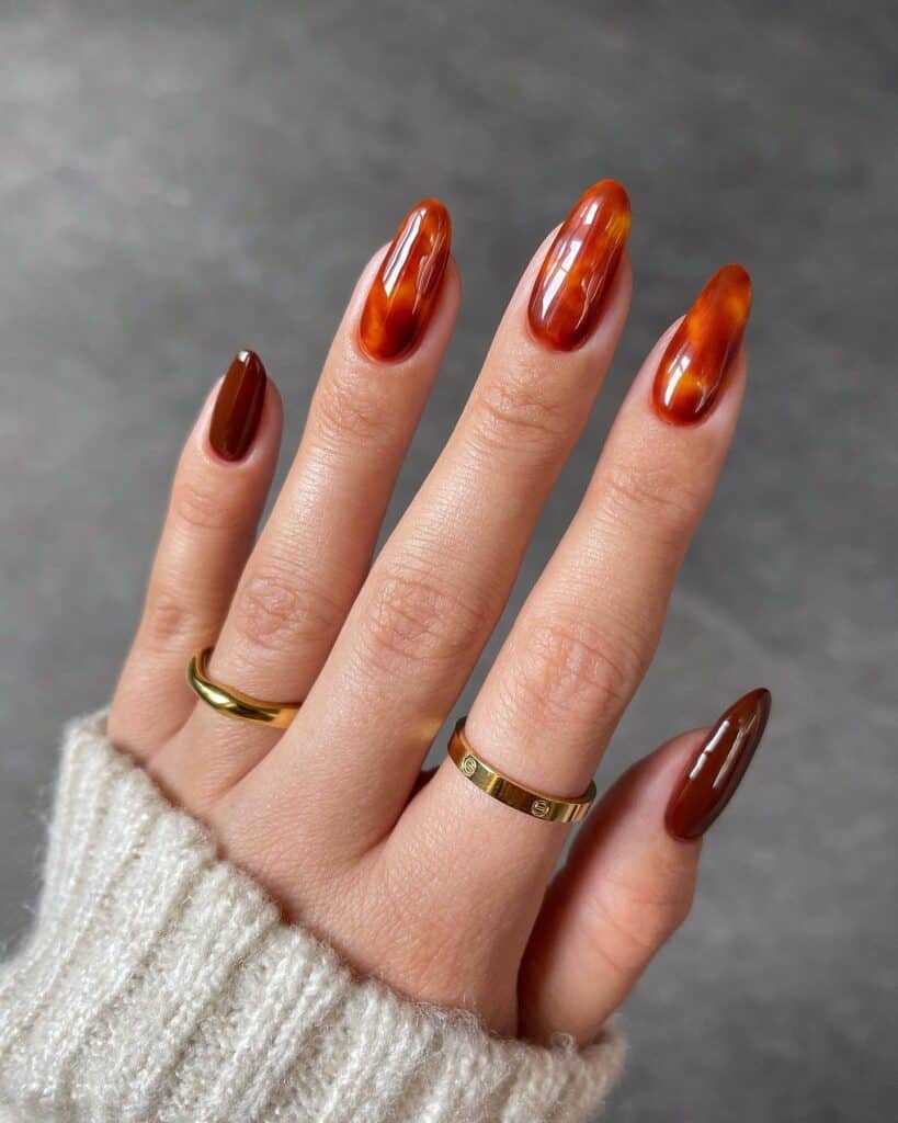 Discover the charm of amber nails with a variety of creative designs, from gel to acrylic styles. Find inspiration for your next manicure.