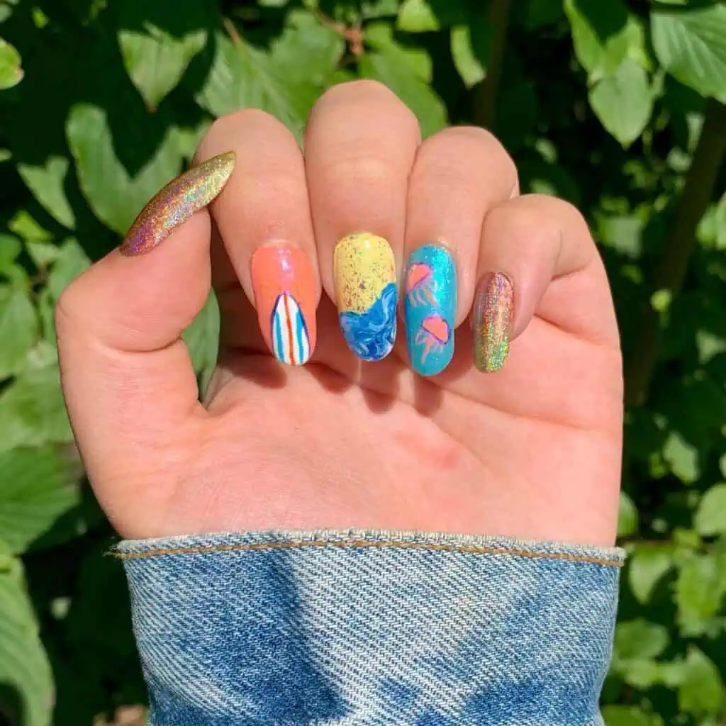 A selection of seaside-inspired nail art showcasing sea blues, sandy beige, and sunset hues, ideal for summer getaways.
