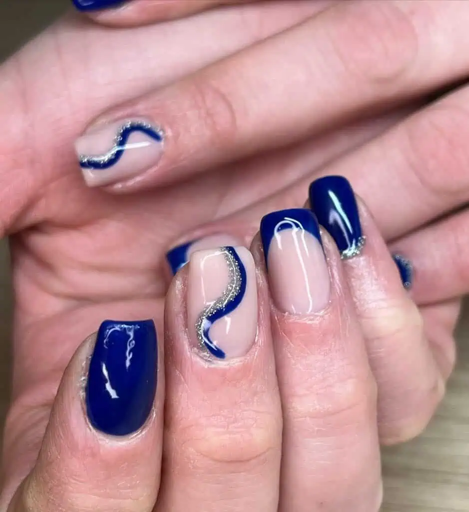 Varied blue nail designs showcasing light blue nails, royal blue acrylic nails, and blue French tips in different hand poses.
