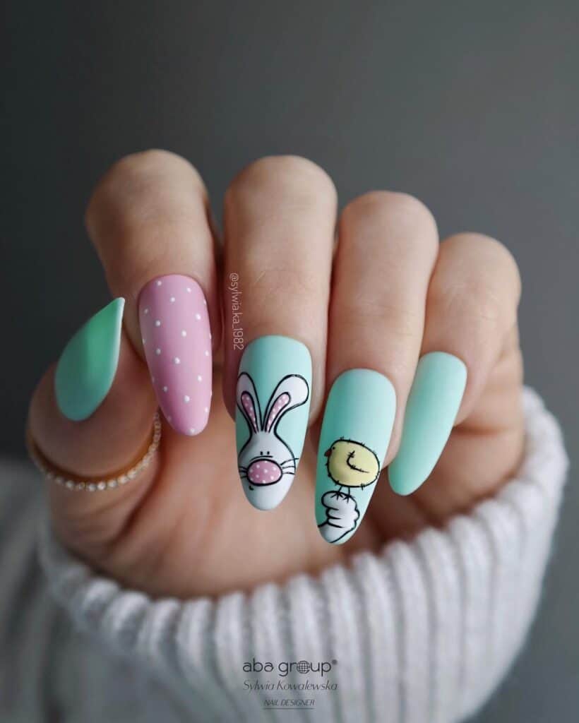 Charming bunny-themed nail art on soft pastel nails – ideal Easter designs for a vibrant spring vibe!