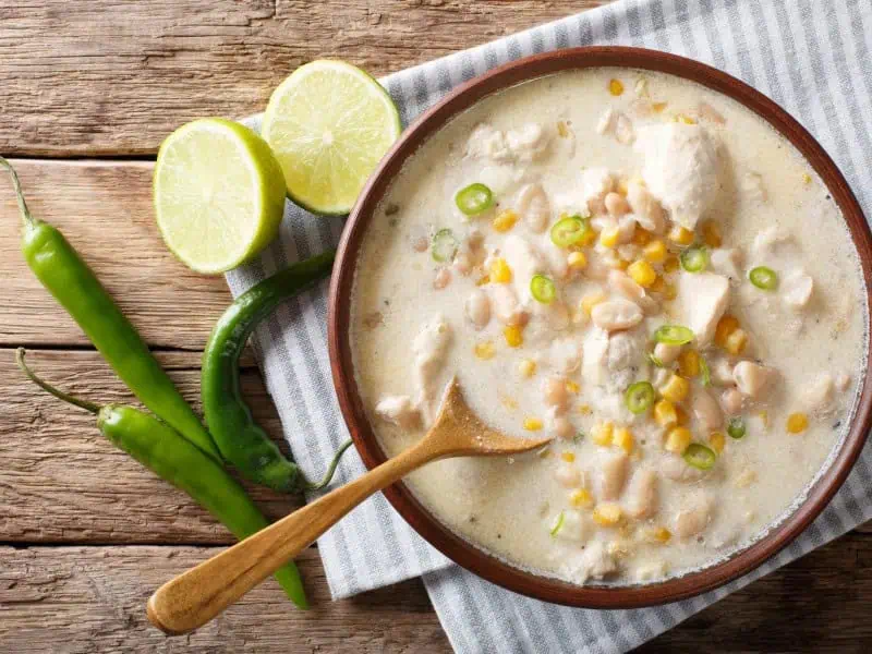 image 1742 - When the weather outside turns frightful, a bowl of Creamy White Chili is so delightful! Filled with savory chicken, hearty beans, and spicy green chiles in a gorgeous white sauce, this chili looks and tastes different from traditional chili while still delivering that irresistible warmth. Creamy White Chili makes enough so you can have a fulfilling dinner with plenty of leftovers for later!