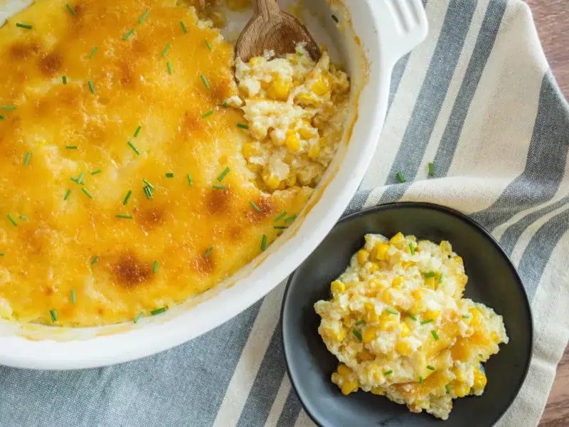 image 181 - Creamed Corn Casserole takes an already beloved side dish and goes the distance with it! The classic taste is made even creamier and heartier with its delicious corn confection that is perfect for pairing with fried chicken, ham steaks, and beefy sandwiches. Bringing a touch of summer sweetness to dinners everywhere, Creamed Corn Casserole is deeply delicious and always a popular dish at potlucks and cookouts. Just make sure to save some for yourself!