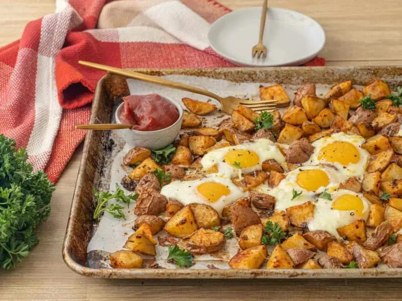 image 1898 - Quick Sheet Pan Breakfast is a one-pan meal that serves up a hearty and hot breakfast designed to get you going! Filled with crispy-on-the-outside, fluffy-on-the-inside, and beautifully seasoned home fries and eggs and set to your desired doneness, you'll be energized and delighted by the flavors.