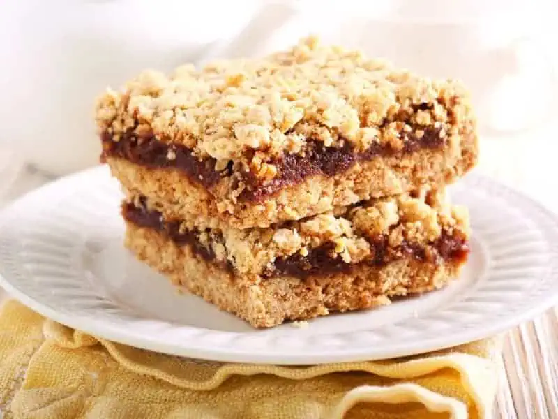 image 247 10 - Betty's Date Squares made with Medjool dates will be the jewel of your next gathering. The sweet date mixture is sandwiched between layers of oaty streusel for a truly unique dessert. Although there is brown sugar in Betty's Date Squares, dates are known for providing a natural sweetness and are used in place of sugar. Double the sweetness with half the sugar!