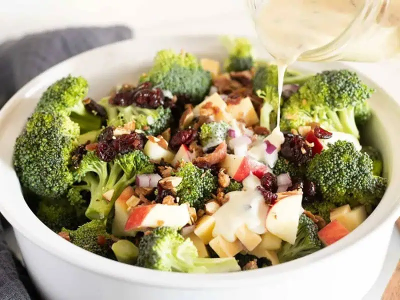 image 247 149 - Loaded Broccoli Salad has a name with a double meaning. It's "loaded" in that it has all the fixings you could want on a salad: creamy, tangy dressing, crunchy apples and nuts, crispy, fatty bacon bites, sharp cheese, the works. But it's also "loaded" in the way all the flavors come together for a rich taste that is both refreshing and satisfying. It takes 30 minutes or less to make this dish, and it's so easy to make, too; next thing you know, you'll be loading your plate with Loaded Broccoli Salad.