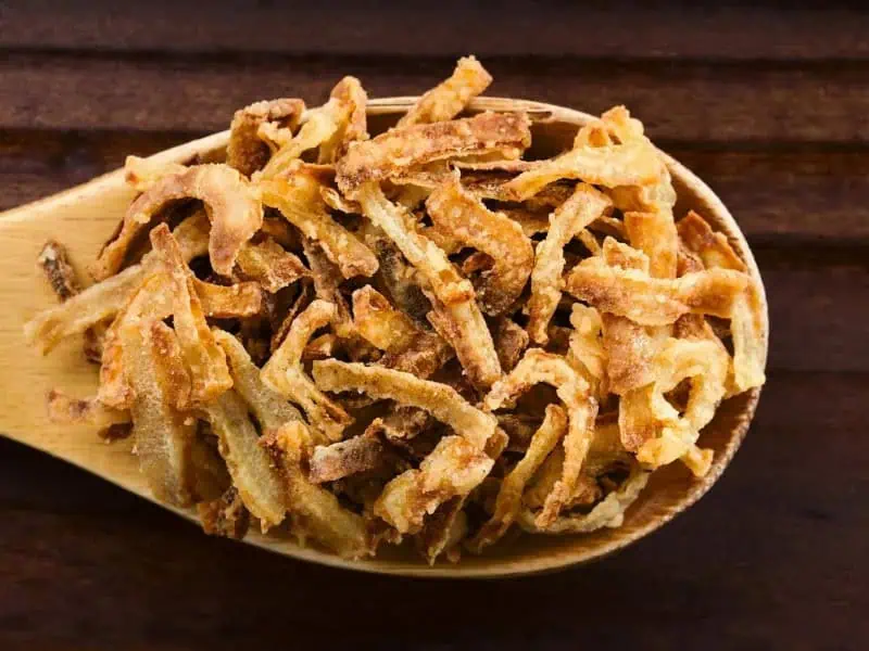 image 247 181 - Easy Onion Strings are one of the most versatile toppings in existence. You can use it on casseroles, mixed in with fries or mashed potatoes, or even as part of a chicken crust. There’s no savory dish that can’t be improved with some crispy and slightly sweet onion strings. Easy Onion Strings let you get the freshest and crispiest bites of onion whenever you want, in 15 minutes or less! Your burgers and steaks will never taste the same again!