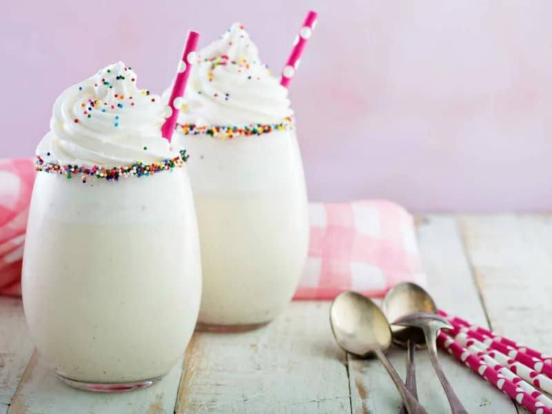 image 247 184 - Birthday Cake Milkshakes have all the sweetness and fun of birthday cake in a frozen, creamy milkshake! Each sip is packed with festive flavors like vanilla and sugary Funfetti® cake. Birthday Cake Milkshakes have changed the dessert game: you don't need to be at a birthday party to have this celebration in a cup!