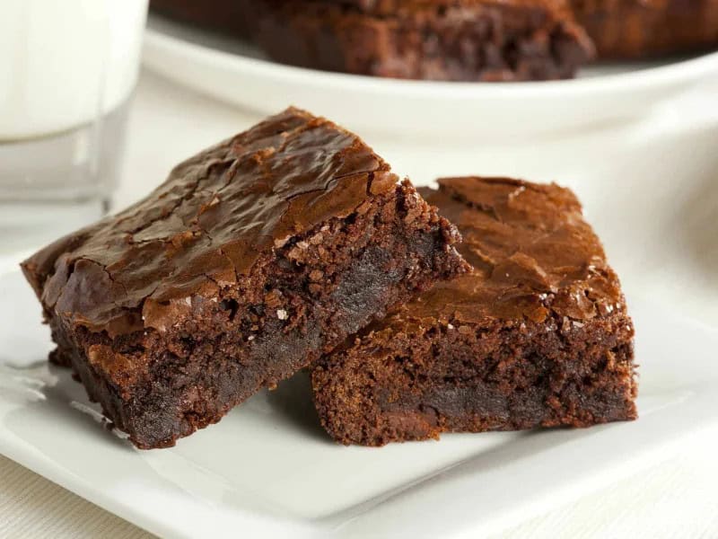 image 247 220 - Classic Brownies. They’re classic for a reason: they’re the best brownies you’ve ever tasted! These confections are rich, chocolatey, and moist—you’ll want them to last forever. Classic Brownies are deliciously sweet treats that disappear in a hurry!